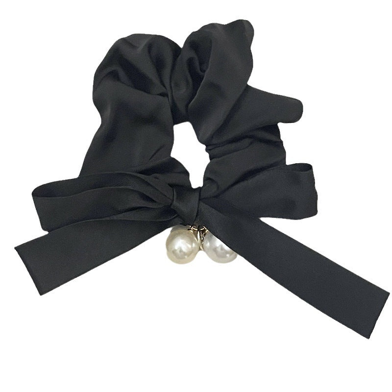 Scrunchie med rosett och pärlor