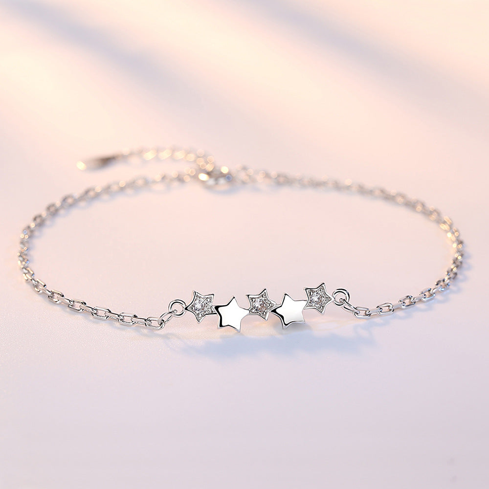 Elegant Armband med stjärna featuring shimmering stars, perfect for women and special gifts from XINGX.