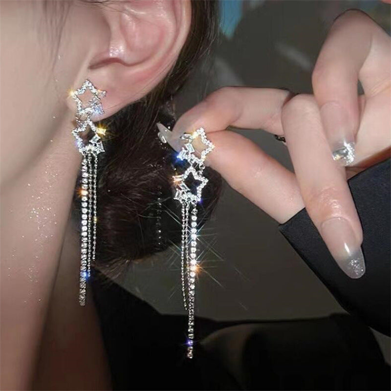 Tassel örhängen med stjärnor