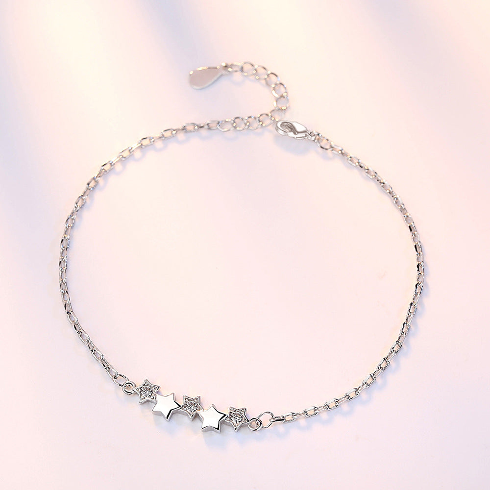 Elegant Armband med stjärna in copper-plated platinum, featuring star shapes and white diamond accents for women.